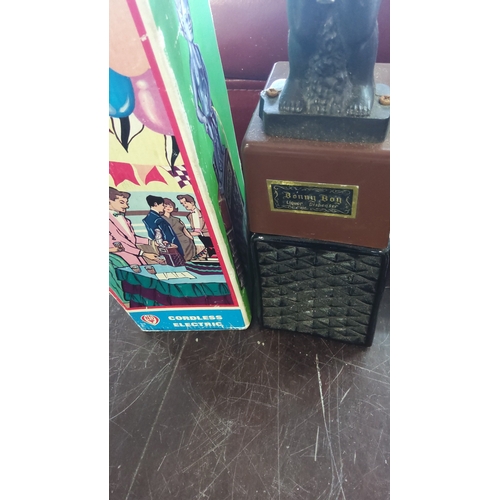 179 - Bonny Boy liquor dispenser, moulded figural spout in black plastic above a brown rectangular reservo... 