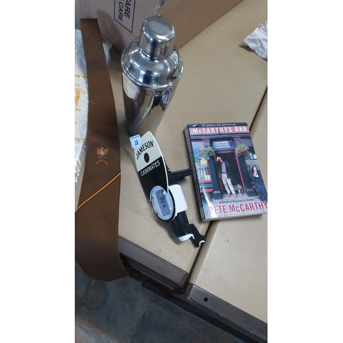 18 - A barware group comprising a vintage Satzenbrau tie,a stainless steel cocktail shaker, a Jameson ‘Ca... 