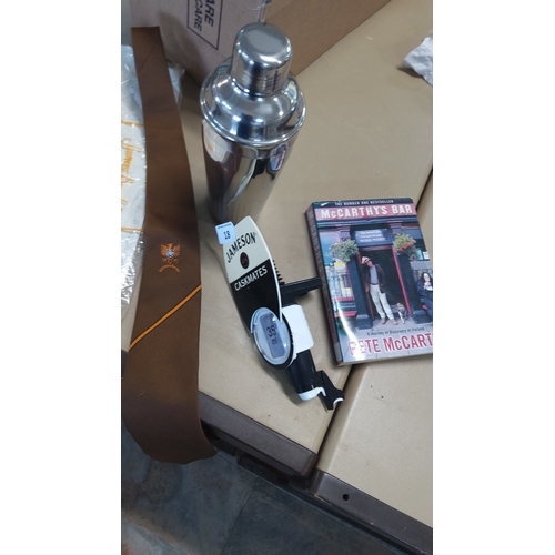 18 - A barware group comprising a vintage Satzenbrau tie,a stainless steel cocktail shaker, a Jameson ‘Ca... 