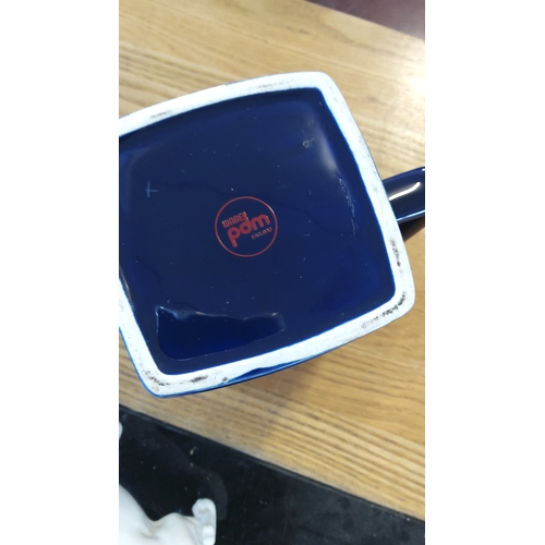 192 - Wade Pottery (England) glazed earthenware advertising water jug, the square-section body in cobalt b... 