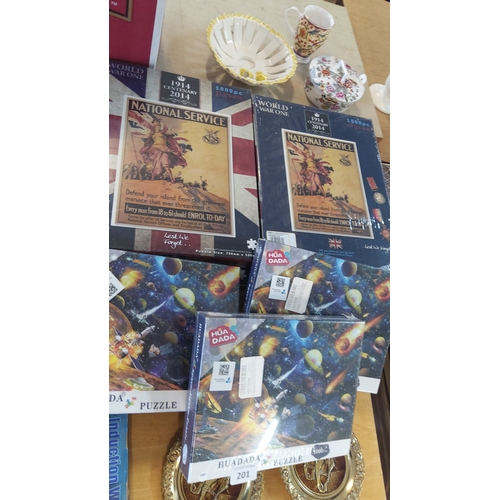 201 - A group of boxed jigsaw puzzles, including Huadada 1000-piece puzzles with space-exploration imagery... 