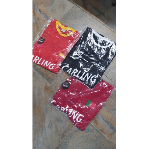24 - A group of Carling-branded shirts (Portugal & Spain soccer + Scotland Rugby all size large)