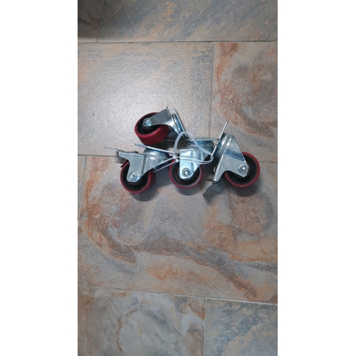 25 - A group of four caster wheels