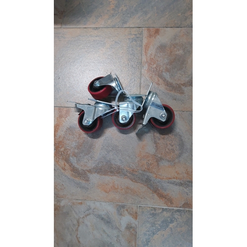 25 - A group of four caster wheels