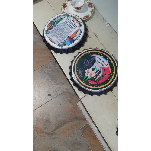 26 - Two bottle-cap form metal wall plaques, printed with Irish-themed graphics: one centred with the tex... 