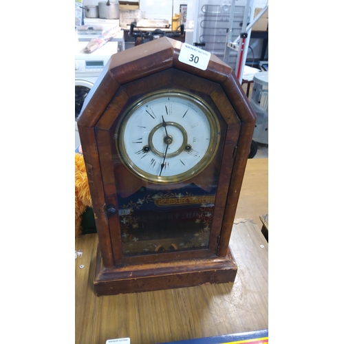 30 - Victorian-style walnut mantel clock, the octagonal case with glazed door enclosing an enamel dial wi... 