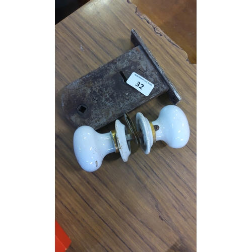 32 - Early 20th century door mortice lock with ceramic knob set—white glazed knobs with brass collars and... 