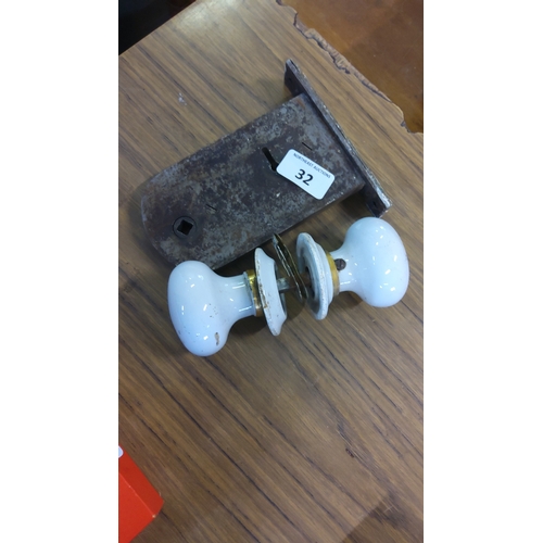 32 - Early 20th century door mortice lock with ceramic knob set—white glazed knobs with brass collars and... 