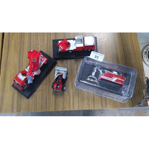 35 - A group of die-cast scale models including a Morita Super Gyro Ladder MLEX5-30 fire appliance on dis... 