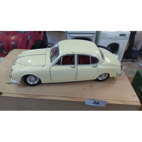 36 - Corgi Toys die-cast model car, after a Jaguar Mark 2 saloon, finished in cream with red interior, op... 
