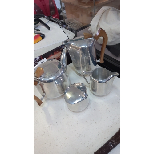 40 - Mid-20th century aluminium four-piece tea and coffee service, comprising a coffee pot, teapot, milk ... 