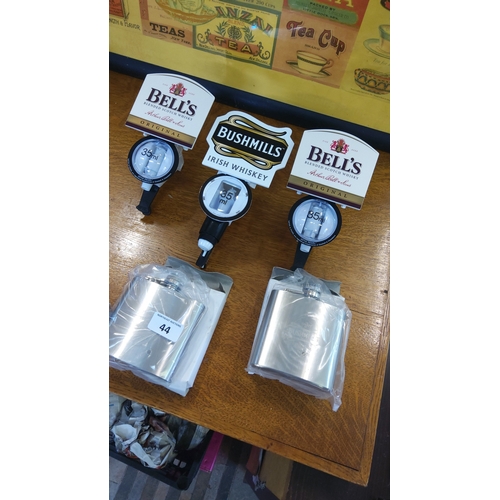 44 - A group of whisky bar accessories including three plastic Optic Pearl 35 ml spirit measures with Bel... 