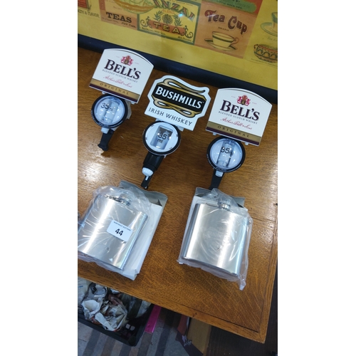 44 - A group of whisky bar accessories including three plastic Optic Pearl 35 ml spirit measures with Bel... 