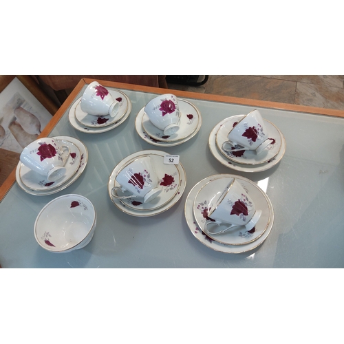 52 - Wawel porcelain part tea service, made in Poland, decorated with burgundy roses and gilt line border... 