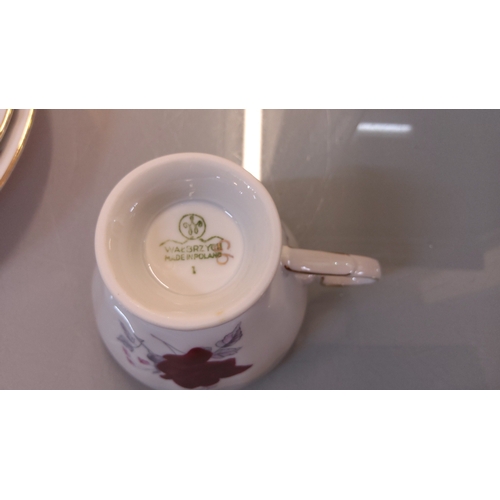 52 - Wawel porcelain part tea service, made in Poland, decorated with burgundy roses and gilt line border... 