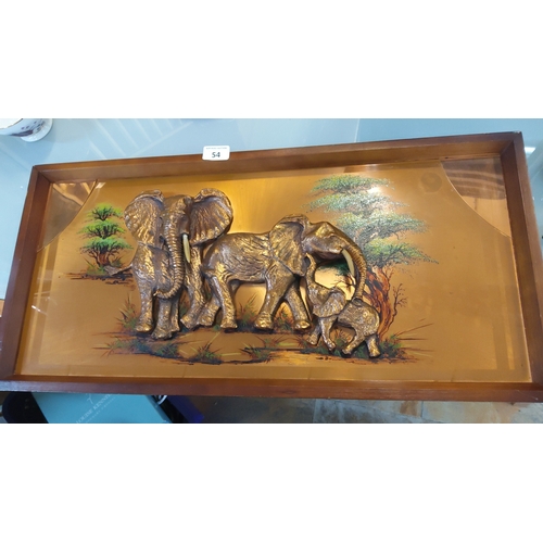 54 - Wall-mounted shadow-box diorama—three-dimensional relief of elephants in gilt-toned metal with ivory... 