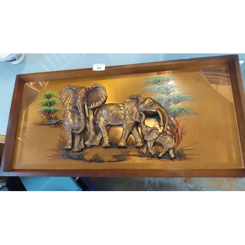 54 - Wall-mounted shadow-box diorama—three-dimensional relief of elephants in gilt-toned metal with ivory... 