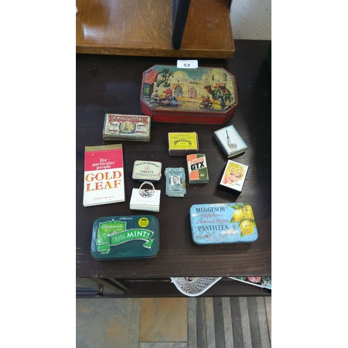 57 - A collection of vintage tins and packets, including an octagonal painted tin with Orientalist market... 