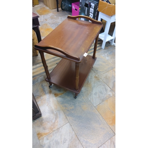 59 - Twentieth-century stained wood sweet trolley, the rectangular top with raised gallery ends above an ... 