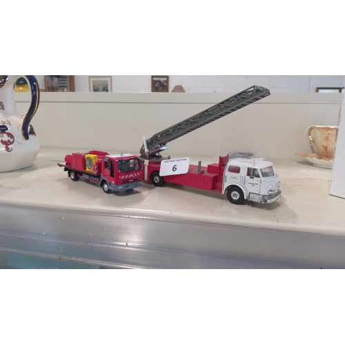 6 - A group of model fire service vehicles, comprising a red Mercedes-Benz fire appliance with roof equi... 