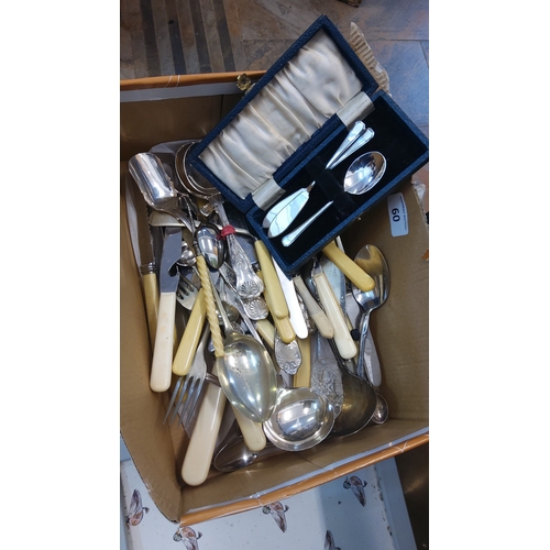 60 - A quantity of silver-plated flatware and serving pieces, including assorted spoons, forks, knives wi... 