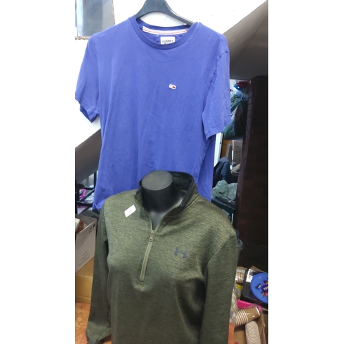 74 - Tommy-branded blue cotton T-shirt with crew neck and small chest flag badge; accompanied by an olive... 