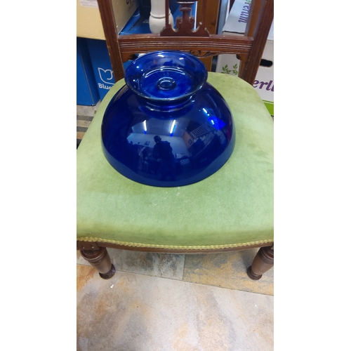 77 - Cobalt-blue glass pedestal fruit bowl, of wide shallow circular form with everted rim and raised on ... 