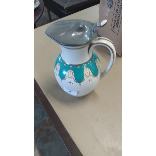 8 - Late 19th/early 20th century earthenware hot-water jug, of globular form with loop handle, turquoise... 