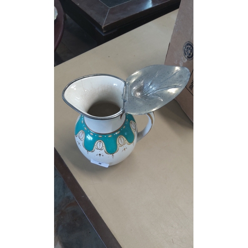 8 - Late 19th/early 20th century earthenware hot-water jug, of globular form with loop handle, turquoise... 