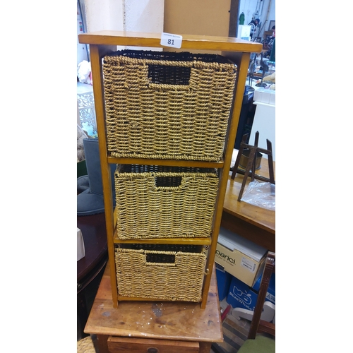 81 - Contemporary honey-stained wood three-tier standing shelf fitted with three removable woven rush bas... 