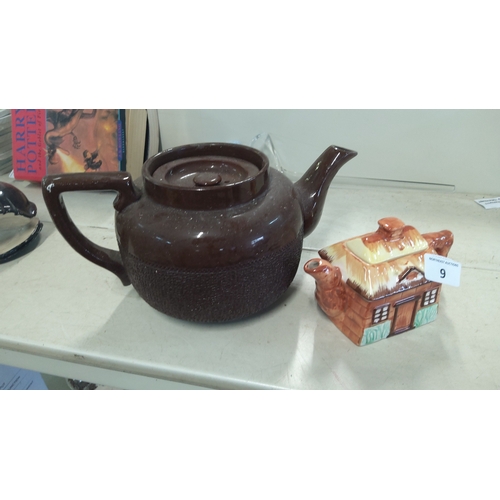 9 - A group of glazed earthenware wares comprising a brown teapot with loop handle, tapering spout and t... 