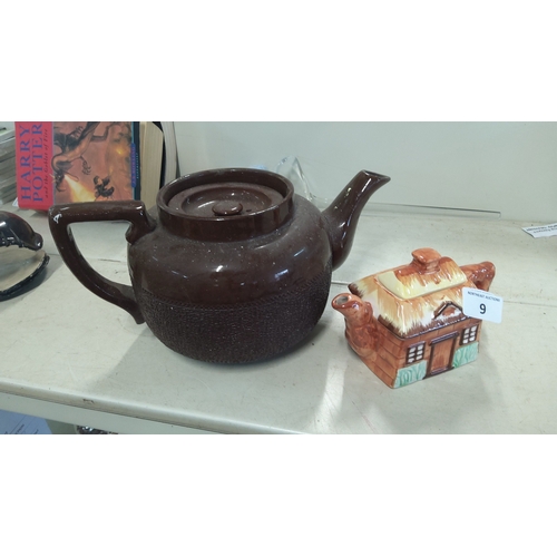 9 - A group of glazed earthenware wares comprising a brown teapot with loop handle, tapering spout and t... 