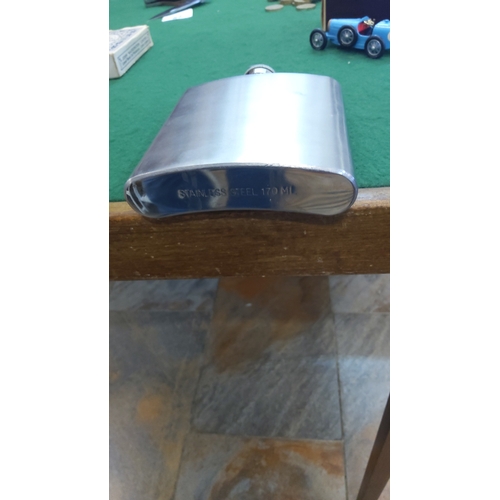 94 - Stainless steel hip flask of rounded rectangular form, with screw cap and attached hinge arm; base s... 