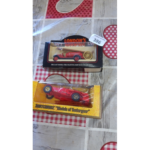 386 - A group of boxed die-cast fire engines, including a 