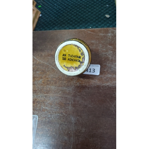 413 - Irish sloganware ceramic table lighter, of barrel form with yellow glaze and black banded decoration... 