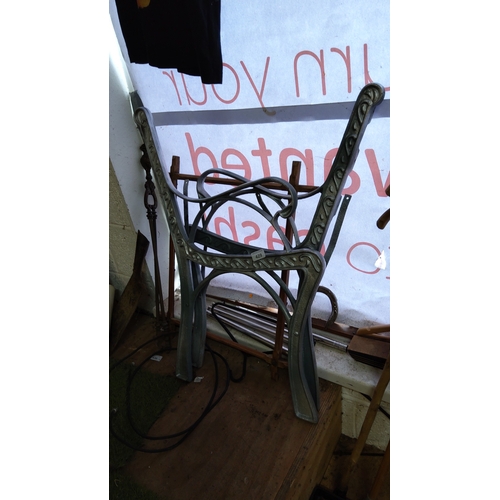 429 - Cast-iron garden bench ends, the back uprights cast with scrolling foliate panels, with interlaced s... 