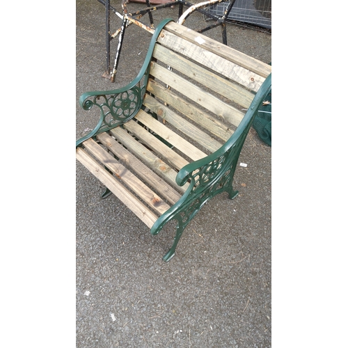 474 - Garden bench seat with cast-iron ends—pierced foliate and scroll panels—and slatted timber seat and ... 