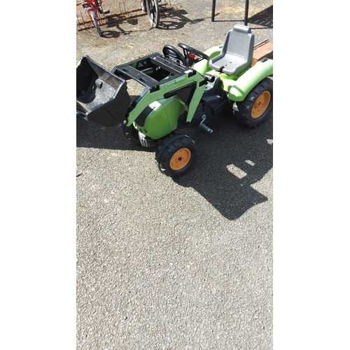 483 - Children’s ride-on pedal tractor in green moulded plastic, fitted with a front-loader bucket and rea... 