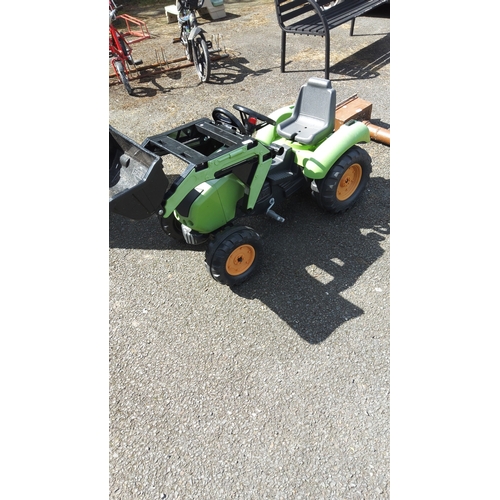 483 - Children’s ride-on pedal tractor in green moulded plastic, fitted with a front-loader bucket and rea... 