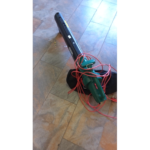 501 - Qualcast electric leaf blower, in green and black moulded plastic housing with integral handle and e... 