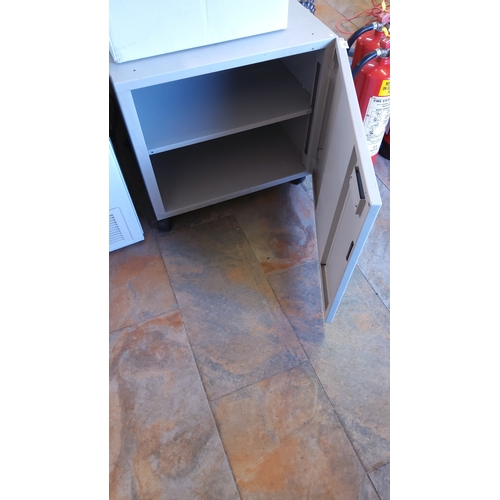 504 - Industrial office cupboard, painted grey, with single hinged door and recessed handle; fitted interi... 