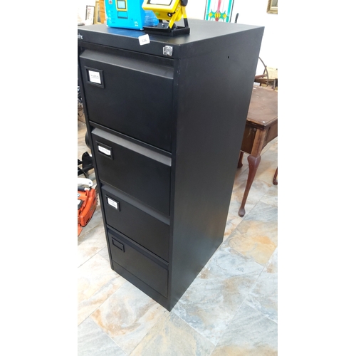 516 - Four-drawer steel filing cabinet with key in black enamel finish, the front with recessed label hold... 