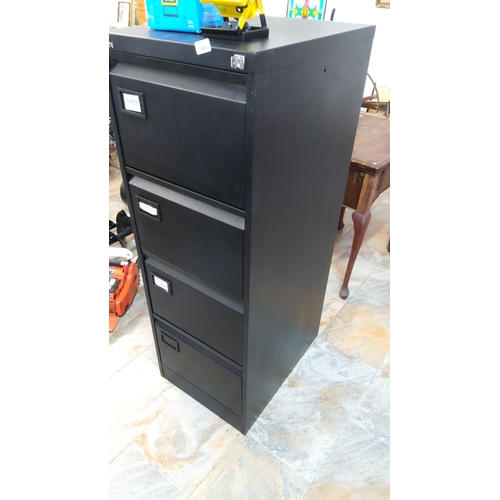 516 - Four-drawer steel filing cabinet with key in black enamel finish, the front with recessed label hold... 