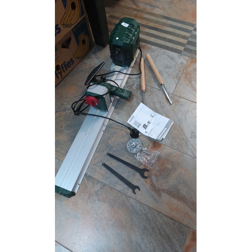 518 - Parkside PDM 600 C3 mini woodturning lathe with metal bed and green motor housing, including instruc... 