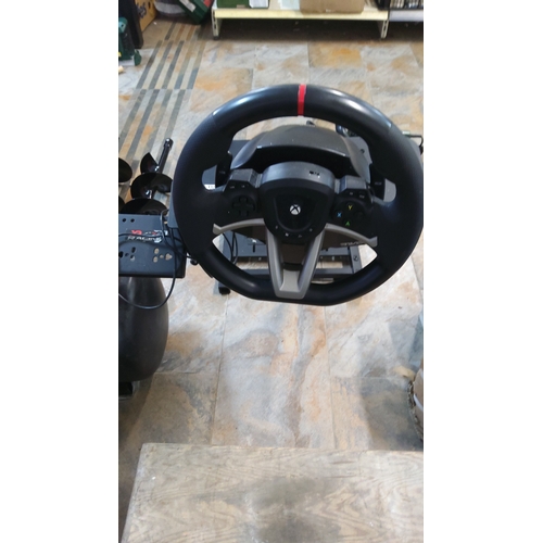 521 - Xbox-compatible force-feedback racing steering wheel with matching pedal unit, mounted on an adjusta... 