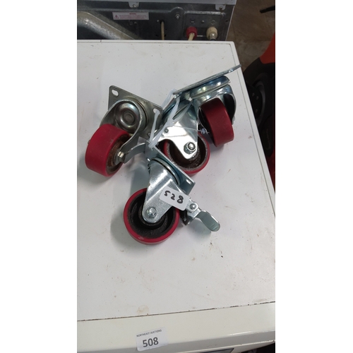 528 - A group of heavy-duty swivel castors in zinc-plated steel, each with a red polyurethane wheel; inclu... 