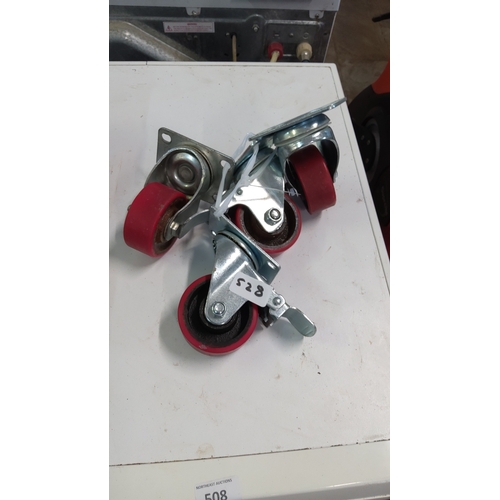 528 - A group of heavy-duty swivel castors in zinc-plated steel, each with a red polyurethane wheel; inclu... 