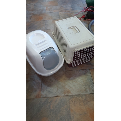 531 - A modern plastic pet carrier of rectangular form with swing handle, louvred sides and metal grille d... 