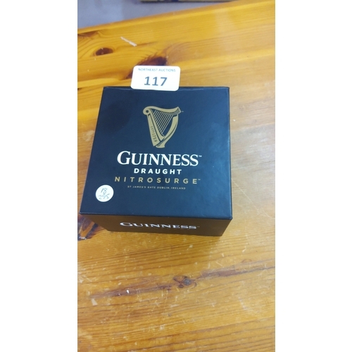 117 - Guinness Draught Nitrosurge device, the black circular unit with gilt harp badge, presented in the o... 
