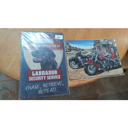 234 - Two modern decorative tin plaque signs, one with a gorilla head and text 'WARNING—THIS HOME PROTECTE... 
